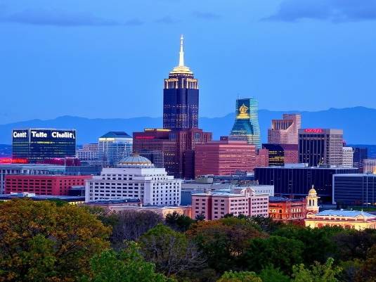 Charlotte NC skyline at sunset showcasing the city's modern architecture.